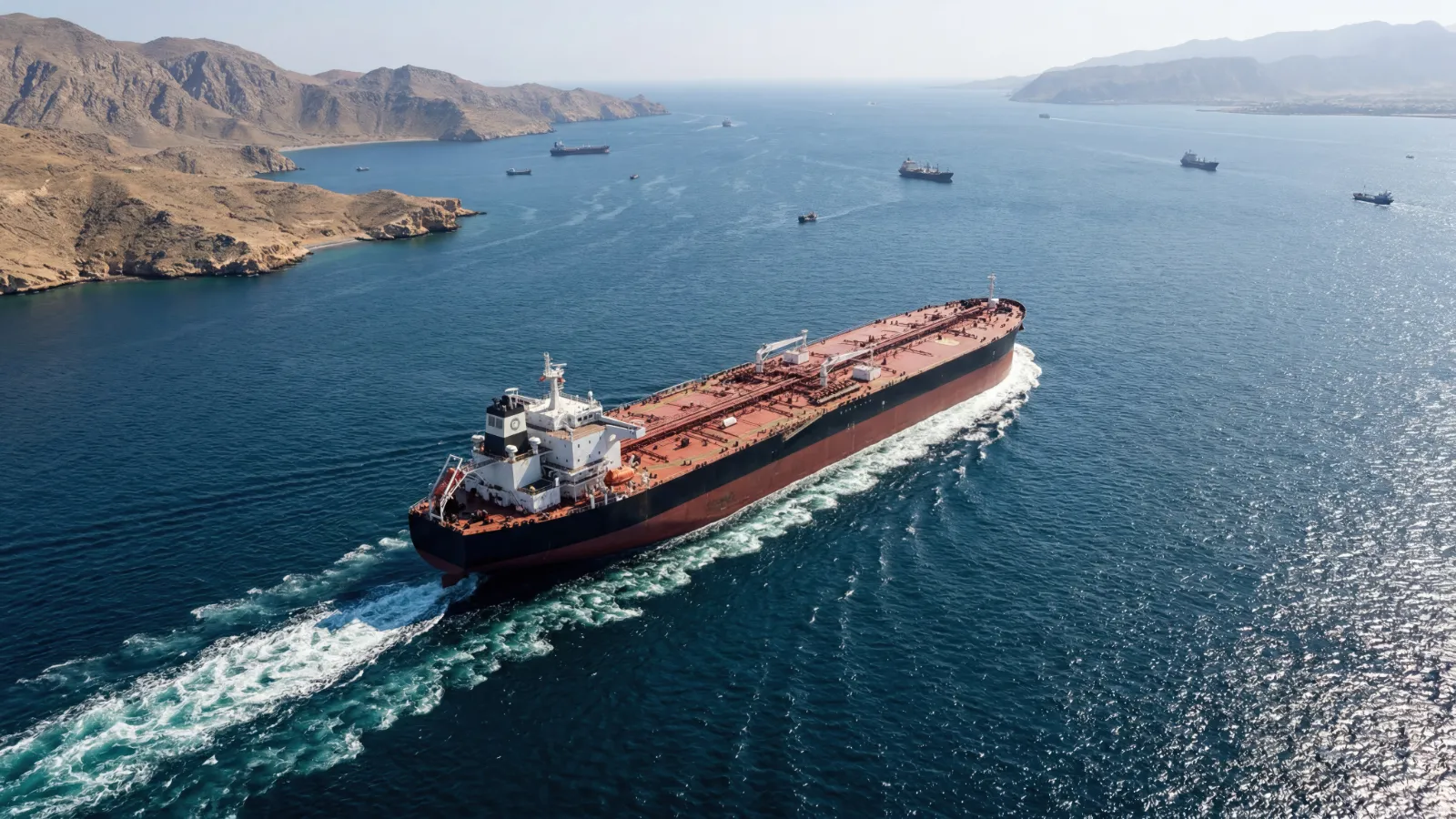 a tanker is passing through strait of hormuz as hormuz toll dispute