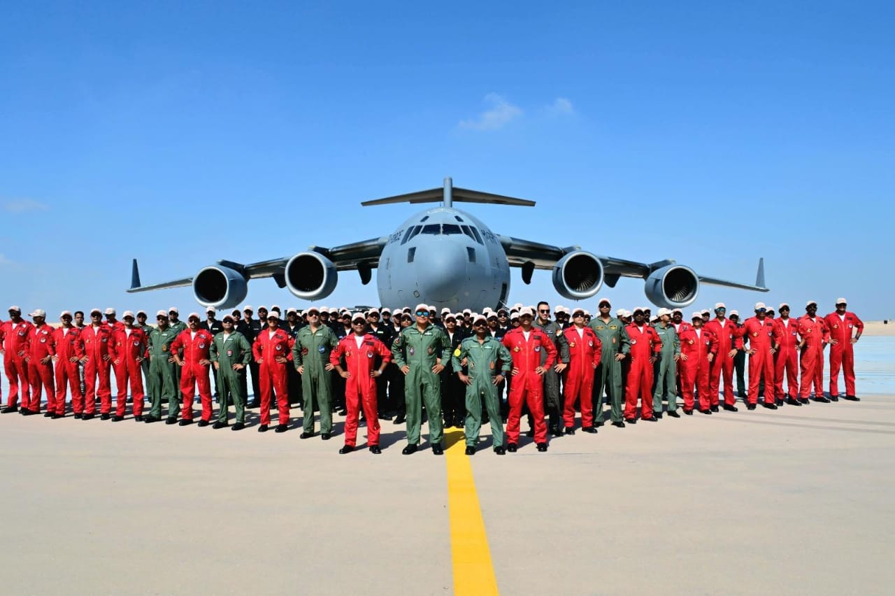 Sarang Helicopter Display Team personnel pose in front of IAF C-17 aircraft in Egypt