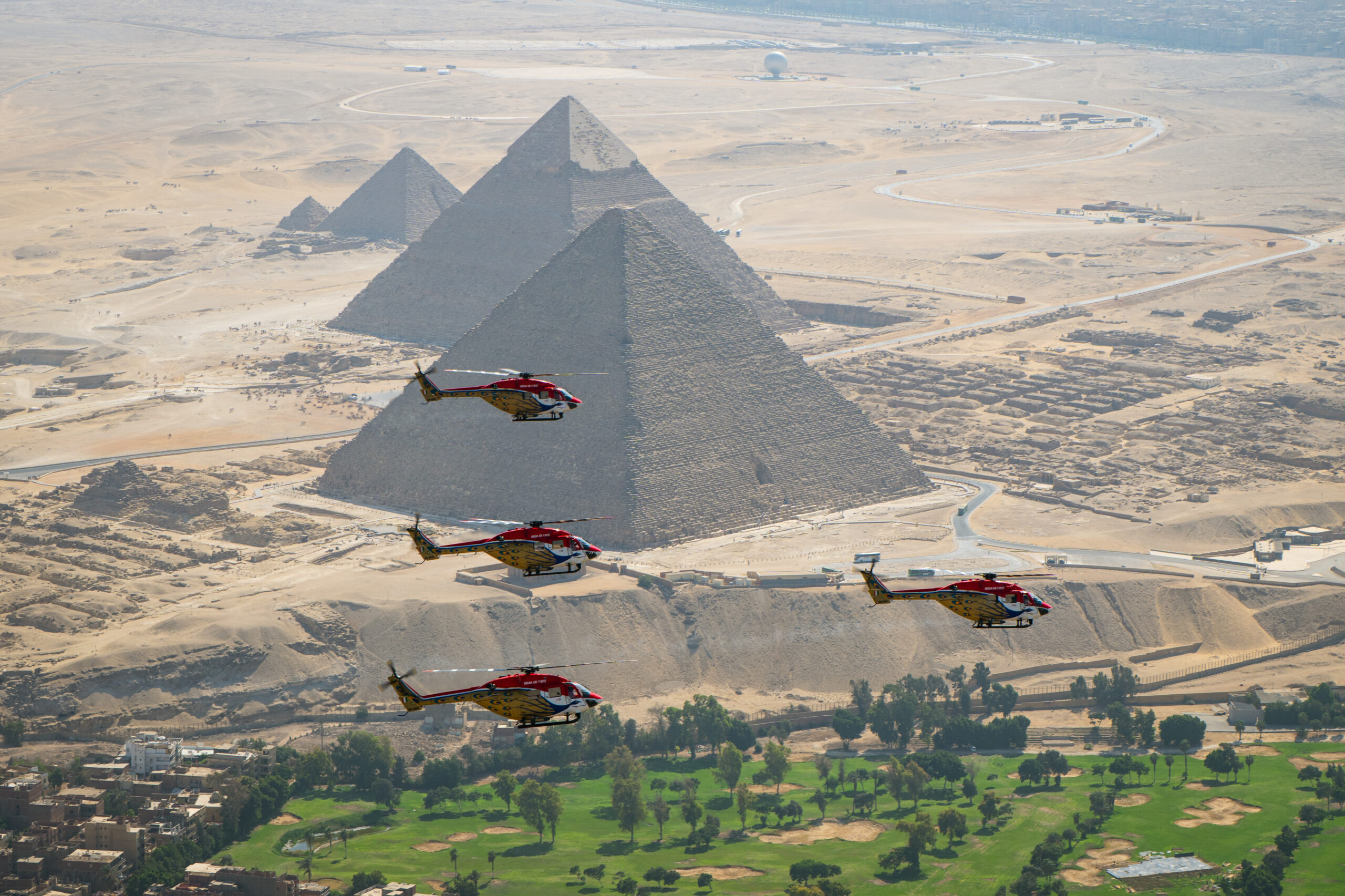 IAF Sarang helicopter team flies formation over the Pyramids of Giza ahead of El Alamein Airshow 2026