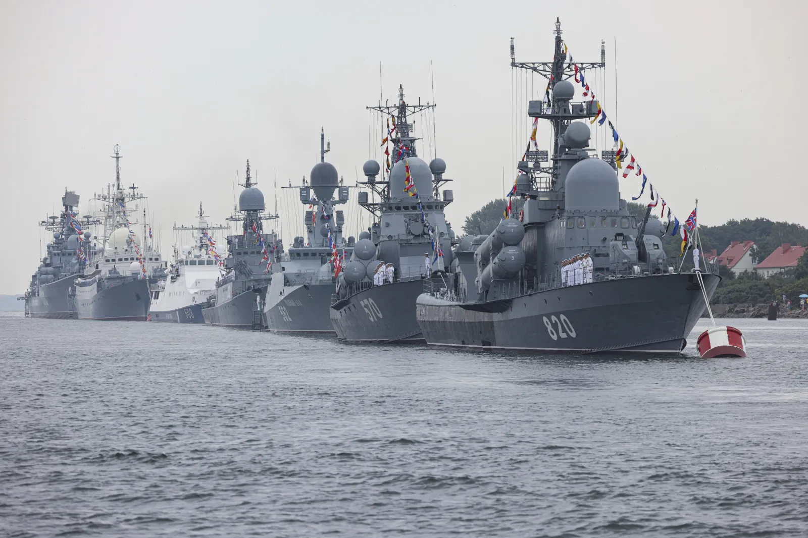 Kaliningrad Nuclear Warning: Russia Threatens NATO With Its "Entire Arsenal" erial view of Kaliningrad's Baltic Fleet harbour with warships docked, overlaid with a map line showing the exclave between Poland and Lithuania — illustrating Russia's nuclear warning to NATO, September 2026.
