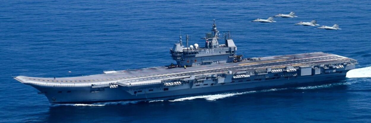 India maritime security: INS Vikrant, the Indian Navy's indigenous aircraft carrier, at sea with four fighter jets flying alongside