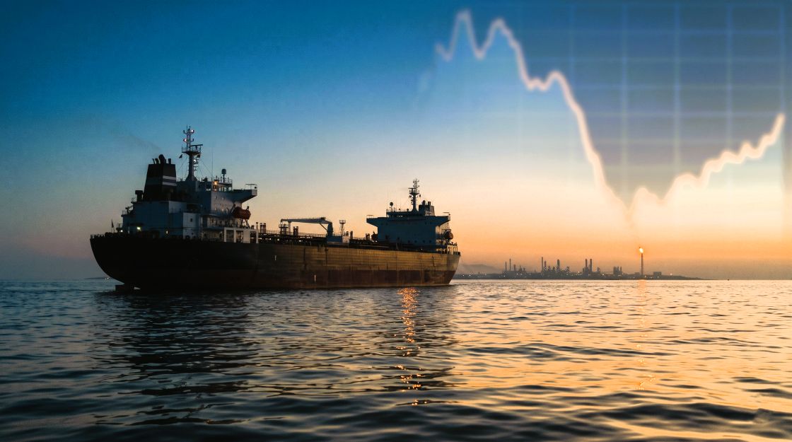 The CFTC Is Probing Oil Bets Before Trump's Iran Announcements. India's Crude Basket Is Now 61% Brent CFTC oil trades probe: a crude oil tanker at dusk with an Indian refinery on the horizon and a faint falling price chart in the sky.