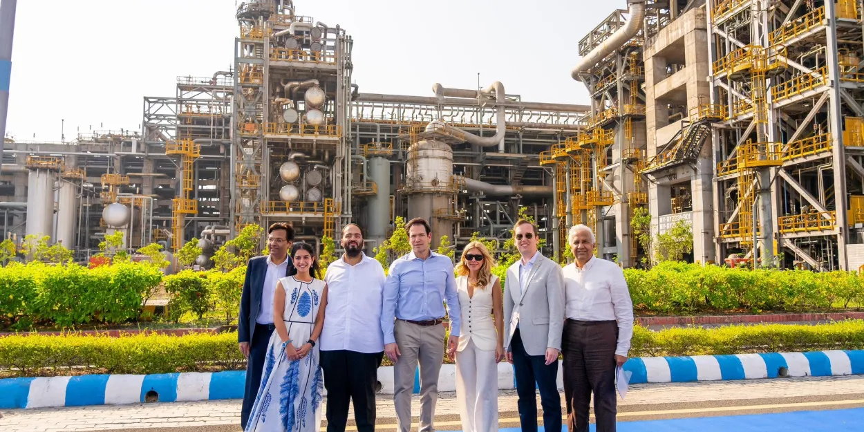 Rubio Jamnagar visit: Marco Rubio, his wife and Ambassador Sergio Gor stand with four others in front of a Reliance refinery unit in Jamnagar