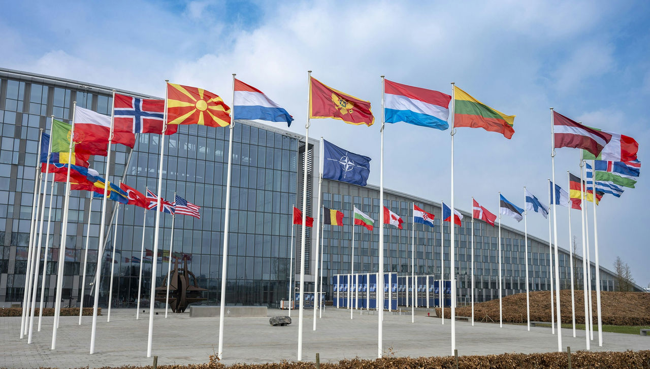 NATO flags displayed outside the alliance office discussing the new NATO Theory of Victory